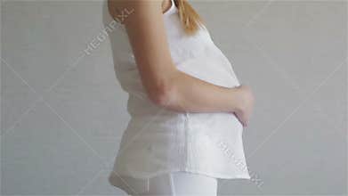 Big belly of a pregnant woman.