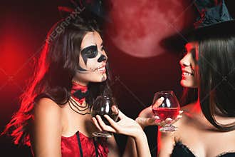 Halloween party 2016! Fashion women like witch holding cocktail