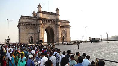 Indian citizens and tourists in front of Gateway to India in Mumbai.