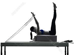 Woman pilates reformer exercises fitness