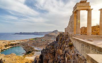 Greece. Rhodes. Acropolis of Lindos. Doric columns of ancient Temple of Athena Lindia the IV century BC and the bay of