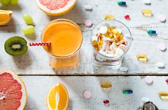 Healthy lifestyle and diet concept. Fruit, pills and vitamin supplements