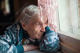 Old woman is sad emotions the home. Loneliness.