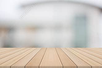 Empty wood table top on white blurred background from building