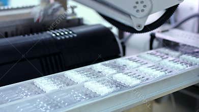 Packaging line at pharmaceutical plant. Pharmaceutical manufacturing line