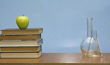 Books and tubes on the desk.