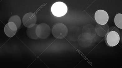 Car traffic at night with headlamps and tail lights twinkling blur