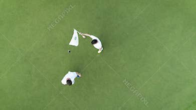 Aerial top view of people playing golf in luxury tropical resort Punta Cana, Dominican Republic