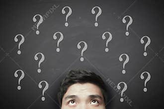 Thinking man with question mark on blackboard