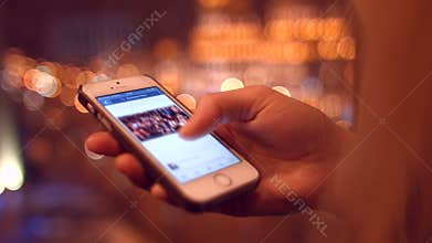 Girl on mobile phone viewing news on facebook. 4K 30fps ProRes