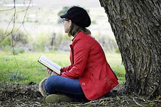 Young Christian woman meditating Gods word in praise and worship