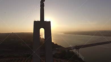 Statue Christ the King Cristo Rei Lisbon Almada at sunset aerial view