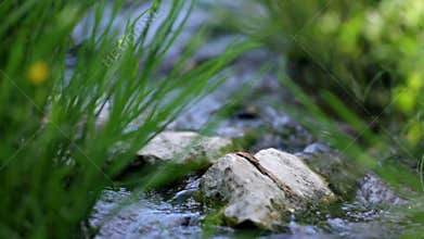 Sliding on water stream running through rocks