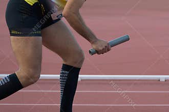 Athletic man running a relays