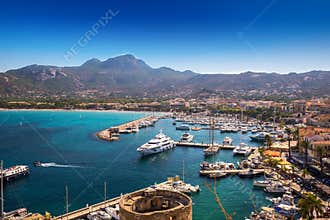 Calvi beach and old town with harbour on Corsica