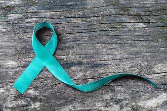 Teal ribbon awareness isolated with clipping path for Ovarian Cancer, Polycystic Ovarian Syndrome PCOS disease, Post Traumatic