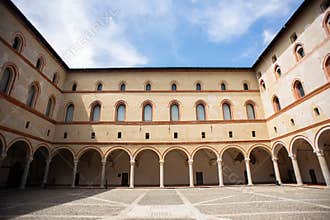 Milan. Courtyard of Sforza Castle Castello Sforzesco. Beige Yellow Walls with Arched Windows and Columns
