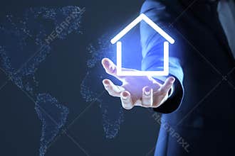 Property insurance concept. Man demonstrating house image, closeup
