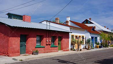 Brightly colored historic adobe houses on Meyer Street in the old Presidio area of downtown Tucson