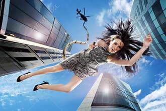 Young brunette falling down the sky