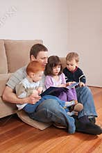 Dad reading story to kids