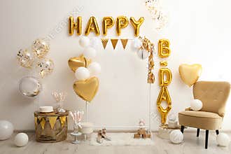Phrase HAPPY BIRTHDAY made of balloon letters in decorated room