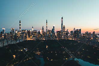 Spectacular Wide View over Central Park in Manhattan at Night with Flashing Cityscape Skyline of New York City