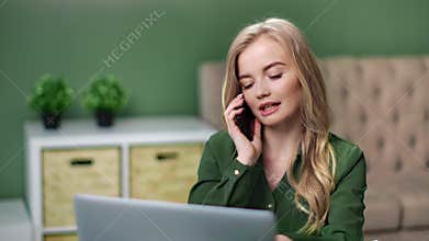 Business woman talk use smartphone work at home with laptop. Medium close up shot on 4k RED camera
