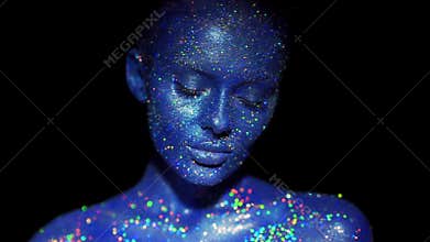 Portrait of beautiful woman with sparkles on her face.
