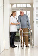 Carer Helping Elderly Senior Man
