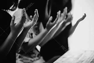 Black and white of group people praying worship believe