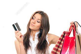 Woman holding credit card and shopping bags