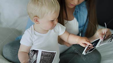 Close up video of mother and son browsing ultrasound images