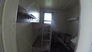 Pan across cell in prison