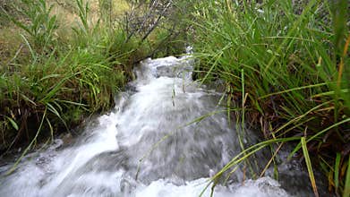 Crystal clear water flowing down the mountain