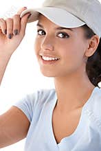 Portrait of young girl in baseball cap smiling