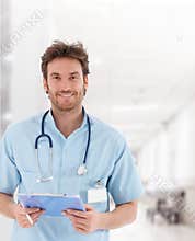 Handsome young doctor on hospital corridor