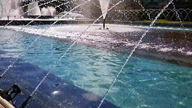 Fountain with water jets in arched form