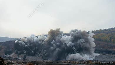 Explosion of rock in coal mining quarry