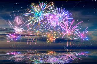 Beautiful happy new year fireworks in the sky with reflections on water