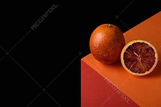 Abstract red orange on illusionary cube on black background