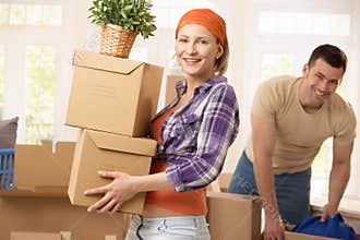 Happy couple moving house