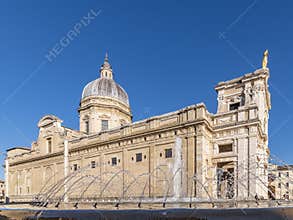 The splashes of the fountain near the basilica of Santa Maria degli Angeli, Assisi, Italy