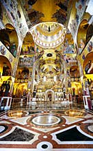 Gold lighted altar central gallery, cathedral church. Byzantium stile interior. Montenegro.