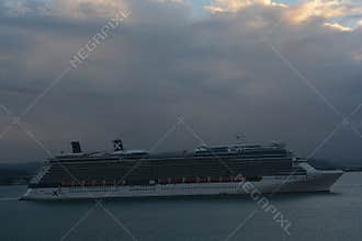 Celebrity Reflection Cruise Ship Sailing Under Cloudy Sky