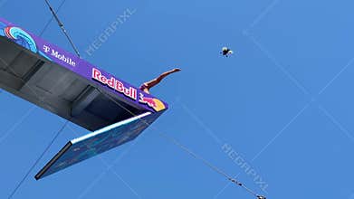 Red Bull Cliff Diving World Series - athlete jumps from Red Bull platform - surrounded by divers