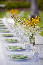 Beach wedding decor table setting and flowers