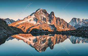 French alps landscape of Lac Blanc with Mont Blanc mountain range reflected on lake in the sunset at Chamonix, France