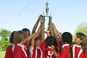 Football Team Raising Trophy
