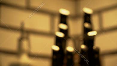 Closeup of knives set and white sauce bottle on white bricks background